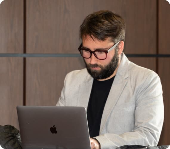 An Image of a man working on his laptop