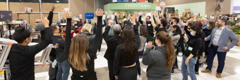 An image representing a supermarket worker celebrating some occassion