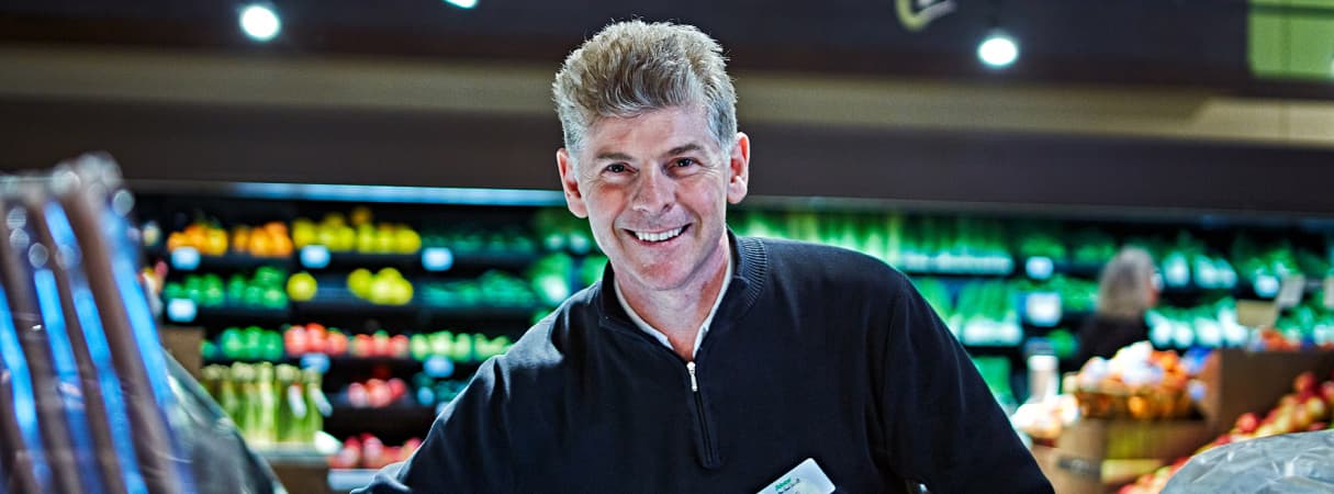 An image of a man working in a sobeys store.